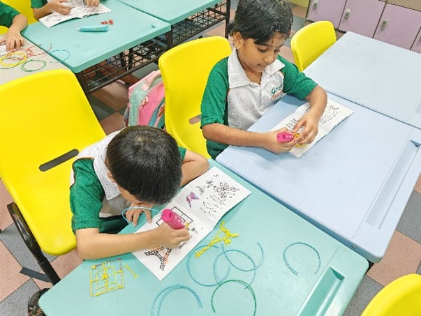 Students learning to use 3D pen to create their design ideas.